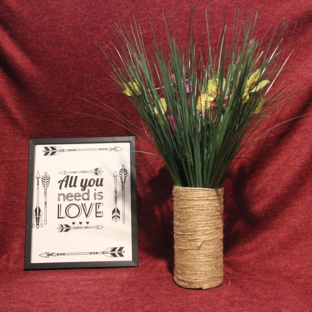 Homemade vase with artificial flowers.